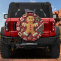 Red Ford Bronco rear with gingerbread cookie man tire cover featuring peppermints and candy canes
