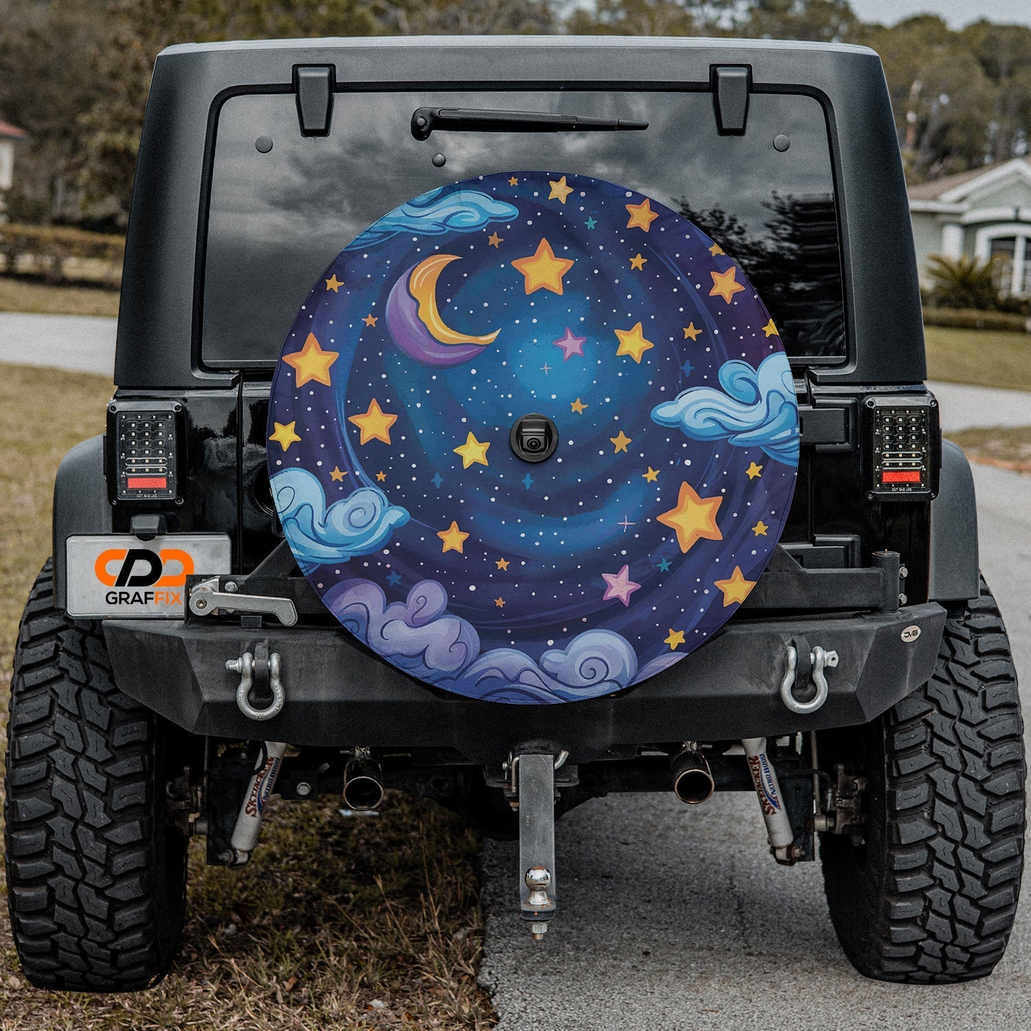 Black Jeep Wrangler with starry night sky tire cover showing moonlit clouds golden stars deep blue space