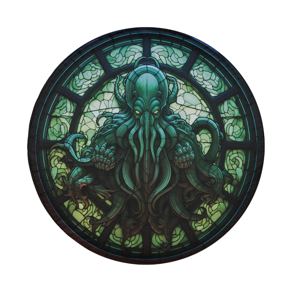 Cthulhu Rising stained glass spare tire cover mounted on a red Bronco rear hatch in a desert landscape scene