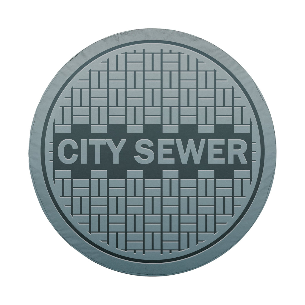 Sewer manhole cover spare tire cover installed on rear of Jeep vehicle