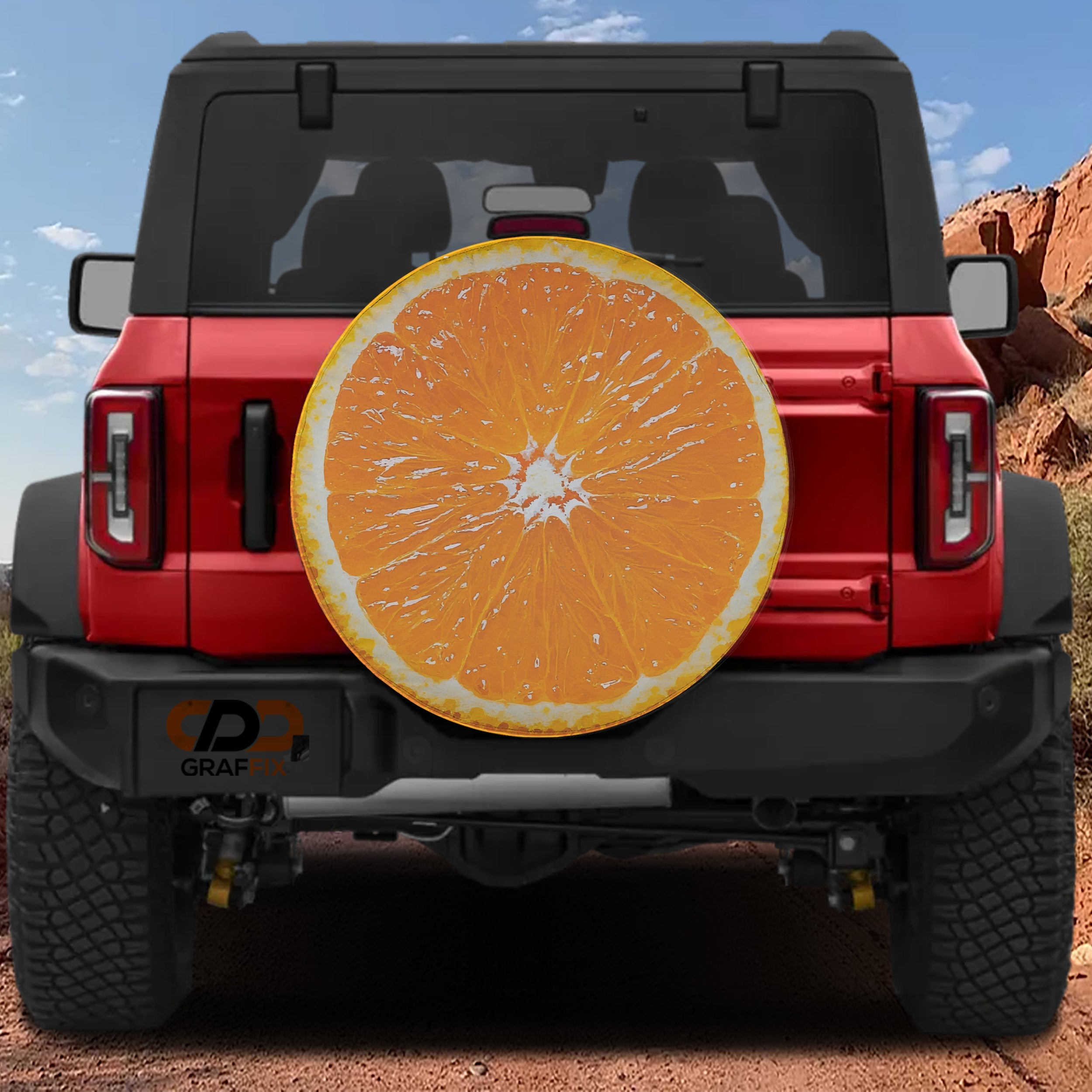 Orange fruit spare tire cover with vibrant citrus slice graphic and bright orange peel design