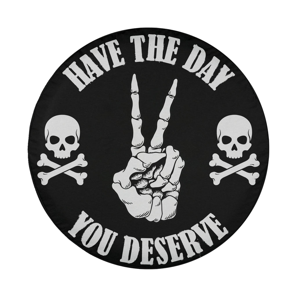A black and white circular logo with the text "HAVE THE DAY YOU DESERVE" and two skull and crossbones symbols on either side.