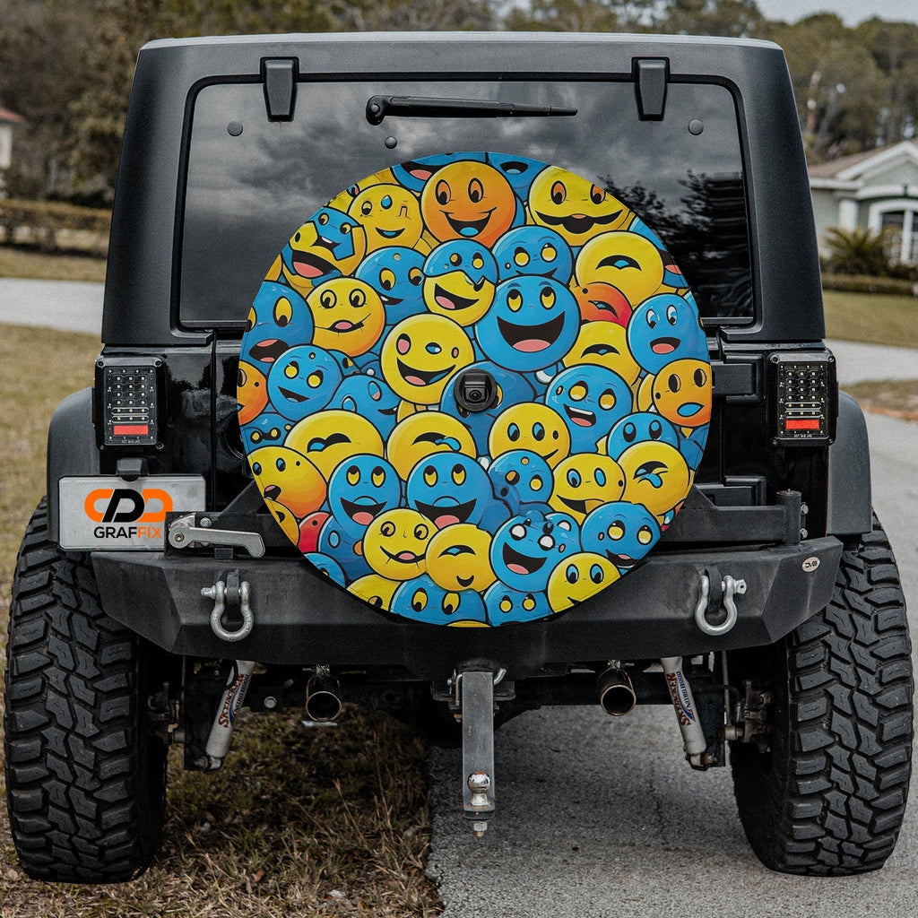 Happy smiley tire cover on black Jeep Wrangler with packed yellow and blue cartoon smiley face pile