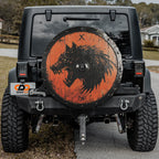 Viking Fenrir shield tire cover mounted on black Jeep Wrangler with orange wood wolf GRAFFIX plate