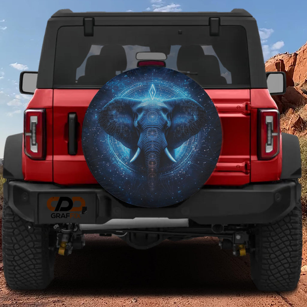 Spiritual Elephant blue cosmic mandala spare tire cover mounted on red Ford Bronco rear with red rocks