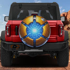 a red Jeep Wrangler with a large, eye-catching wheel cover on the back.