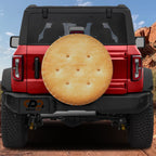 Buttery round cracker stack spare tire cover with stacked golden butter crackers graphic