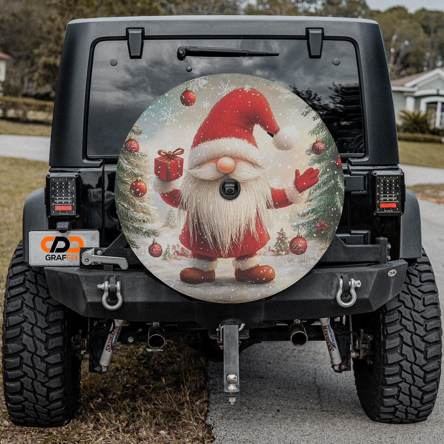 Christmas gnome spare tire cover on black Jeep Wrangler featuring rustic gnome holding present design