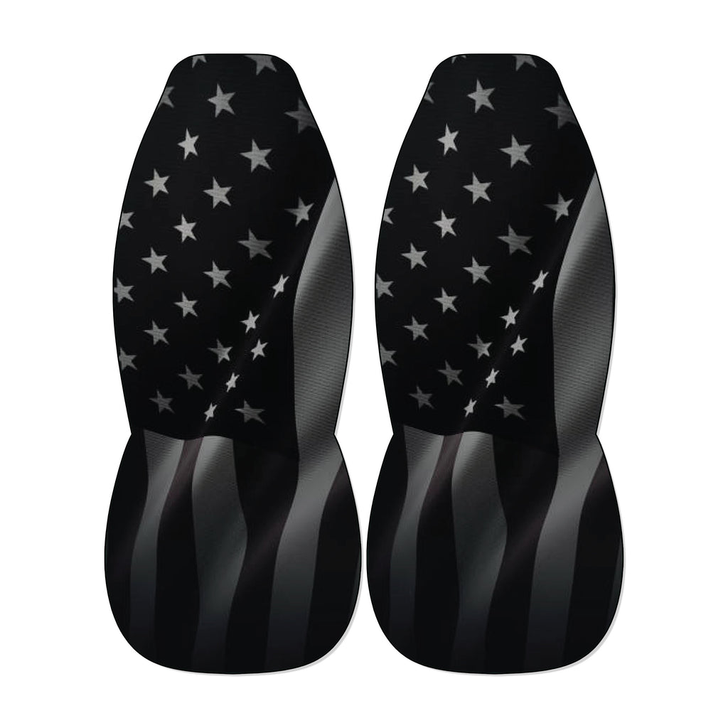 two black car seat covers with a pattern of white stars on a black background.
