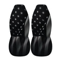 two black car seat covers with a pattern of white stars on a black background.