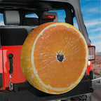Orange fruit spare tire cover with vibrant citrus slice graphic and bright orange peel design