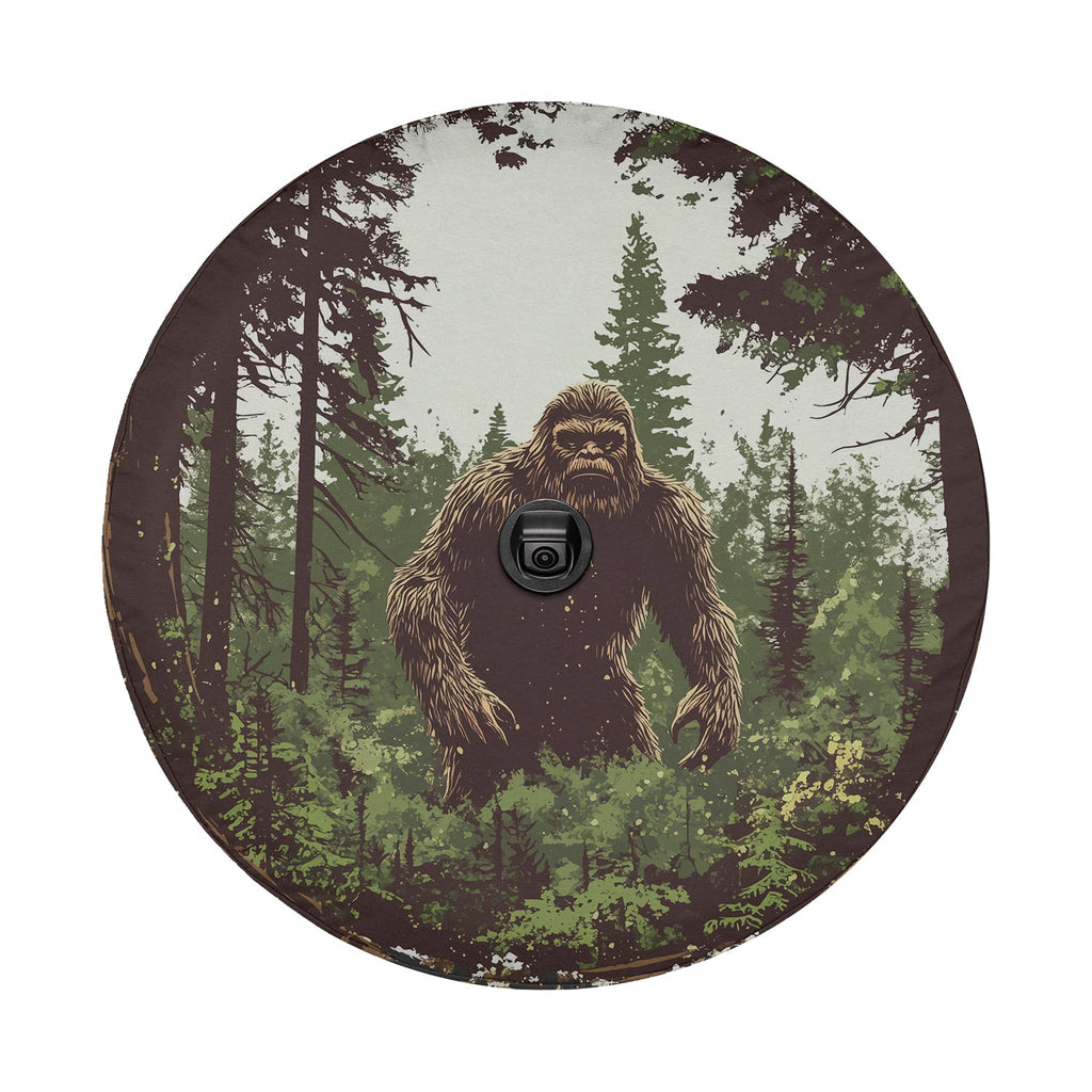 Bigfoot pine trees retro art tire cover mounted on black Jeep Wrangler with GRAFFIX brand plate