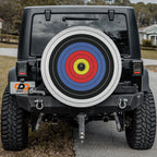 Black Jeep Wrangler with Archery Target ringed bullseye spare tire cover installed on rear