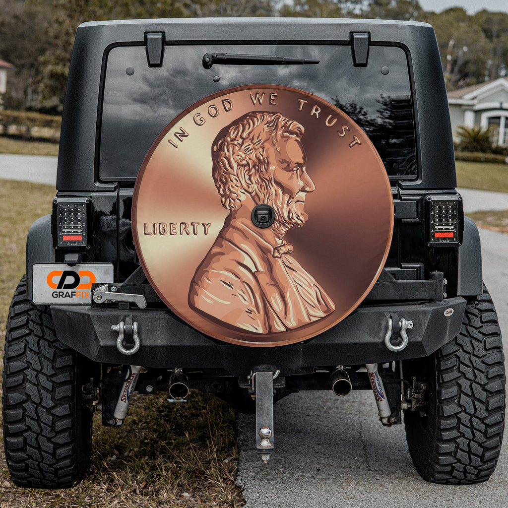 Giant American penny spare tire cover on red Ford Bronco with copper Lincoln penny graphic