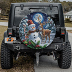 Festive snowman and reindeer themed spare tire cover displayed on a Jeep Wrangler tailgate