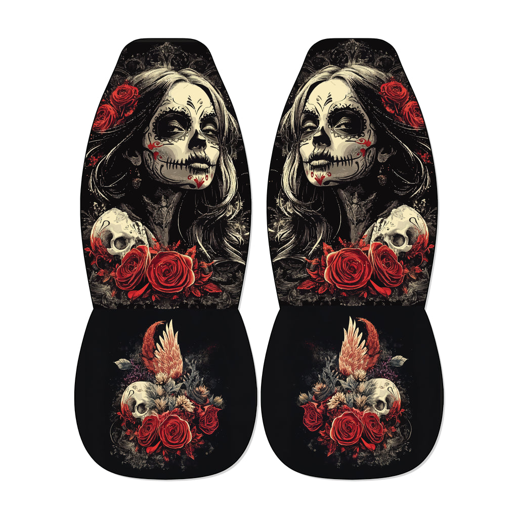 a pair of black and white car seat covers with a skull design and floral elements.