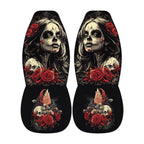 a pair of black and white car seat covers with a skull design and floral elements.