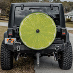 Lime fruit spare tire cover with green citrus slice graphic and zesty sliced lime design