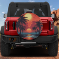 Scarlet horizon palm tree sunset tire cover on red Ford Bronco showing orange beach silhouette scene