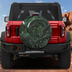 Alien lifeform spare tire cover featuring green H.R. Giger style xenomorph biomechanical artwork detail