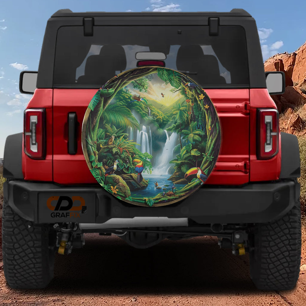 Tropical Paradise Escape tire cover on a red Ford Bronco showing lush waterfall jungle scene with toucans