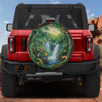 Tropical Paradise Escape tire cover on a red Ford Bronco showing lush waterfall jungle scene with toucans