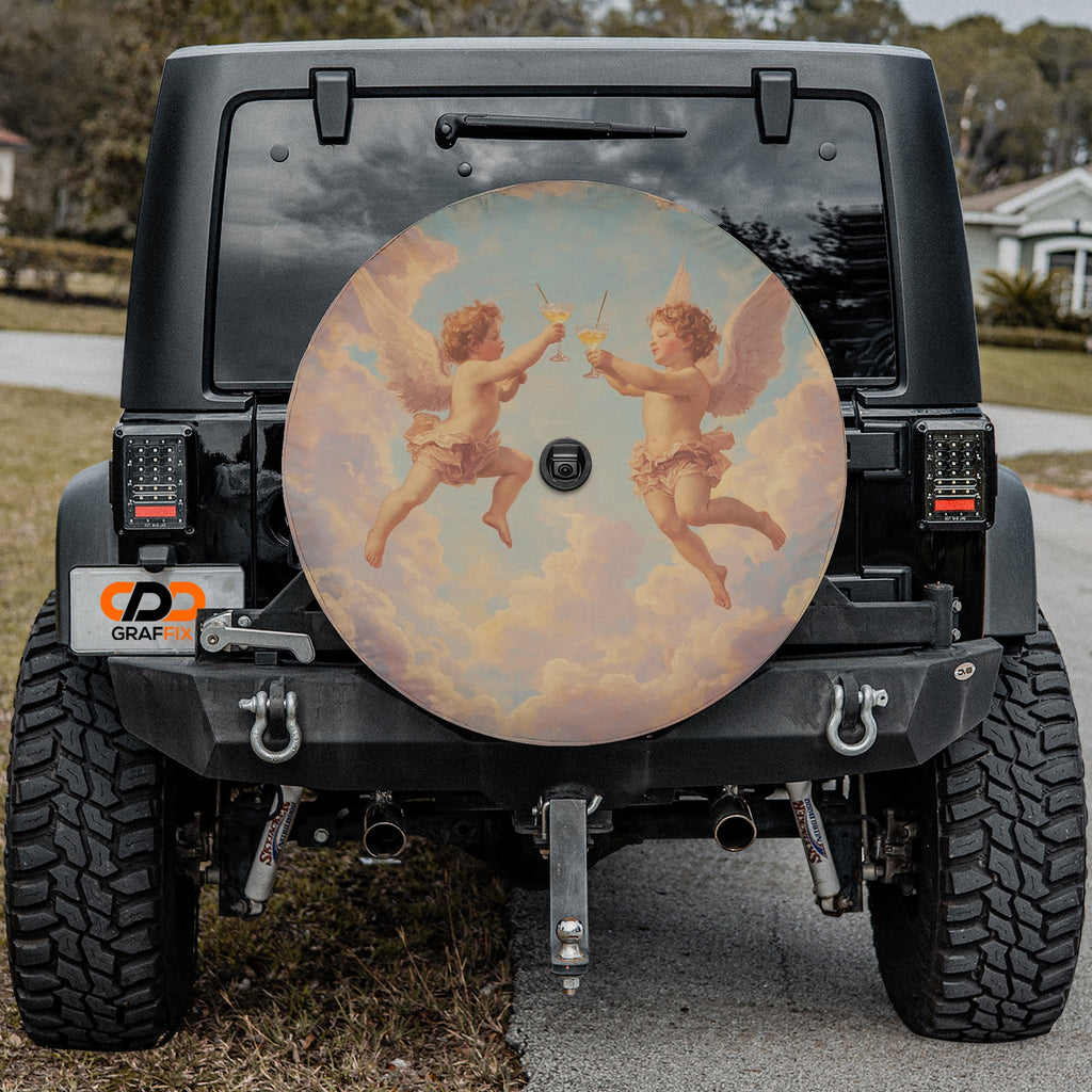 Angels' Toast spare tire cover with cherubs design mounted on black Jeep Wrangler tailgate