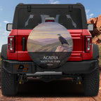 Acadia National Park spare tire cover without a camera cutout, mounted on a red Ford Bronco in red rock country