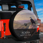Acadia National Park spare tire cover with a bald eagle on a cliff at sunrise, mounted with a backup camera port on a red Jeep Wrangler