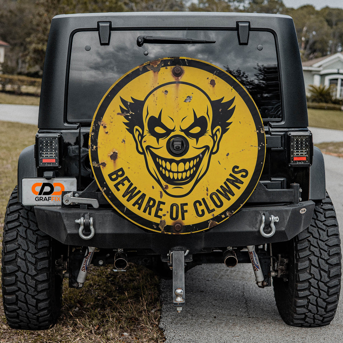 Beware of Clowns spare tire cover mounted on the tailgate of a Jeep Wrangler