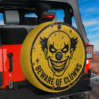 Beware of Clowns spare tire cover on a Jeep, seen from behind on the trail