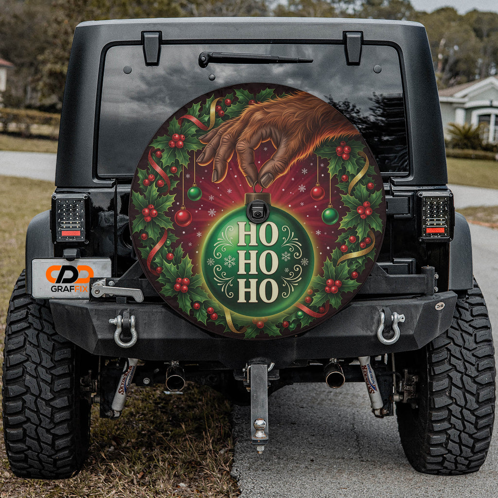 Bigfoot ornament heist Christmas spare tire cover mounted on a Jeep Wrangler
