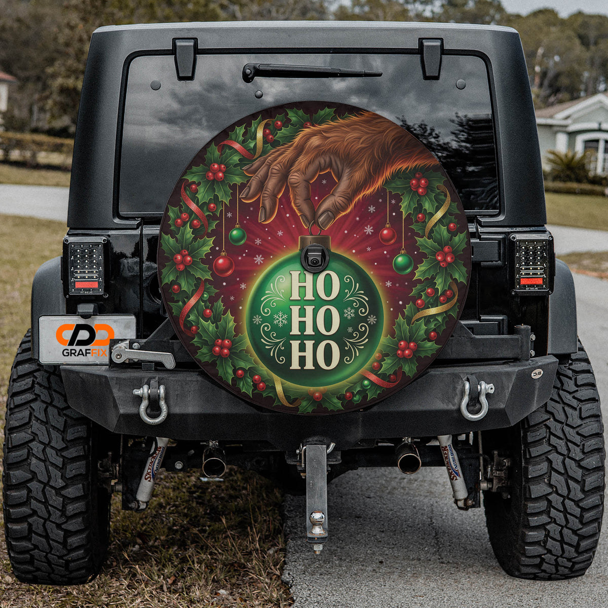 Bigfoot ornament heist Christmas spare tire cover mounted on a Jeep Wrangler