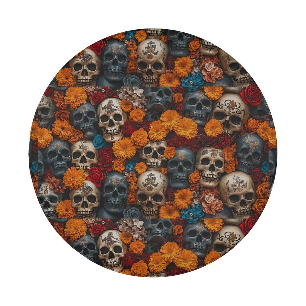Flowers and skulls tire cover flat round front close-up with marigold flowers, roses, and stacked skulls