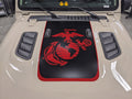 Tan Jeep Wrangler Rubicon hood with a matte black power-dome graphic, red Marine Corps Eagle, Globe and Anchor emblem, and red pinstripe border, two rubber ducks on the cowl