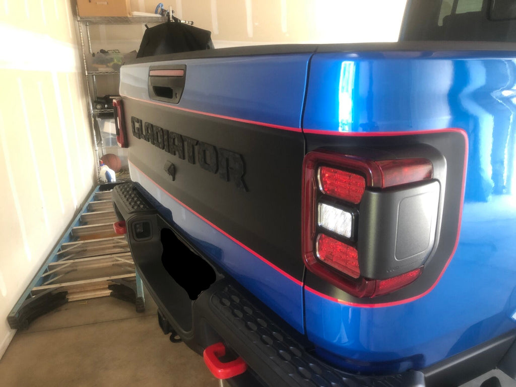 Black bordered blackout decal with red pinstripe applied to blue Gladiator JT tailgate