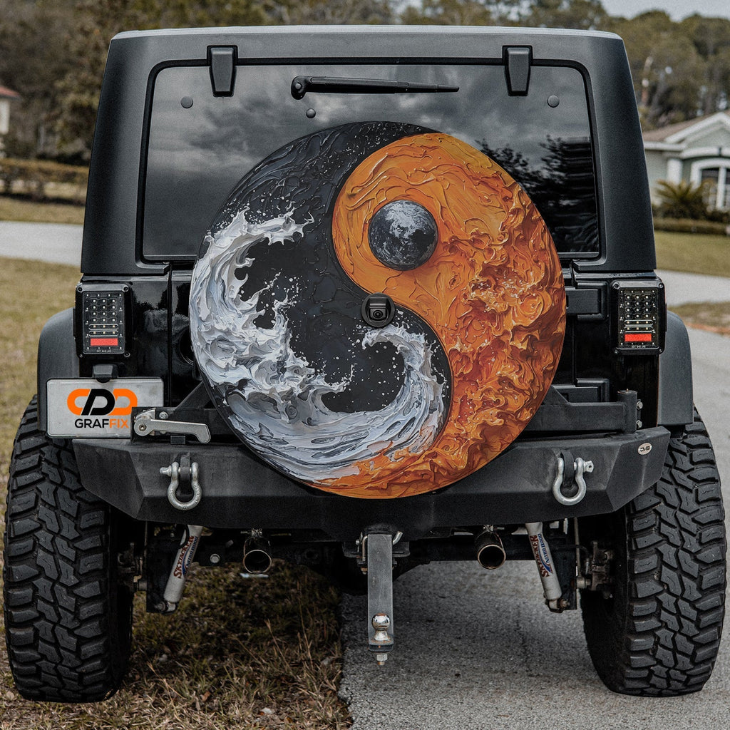 Elemental Balance spare tire cover on black Jeep Wrangler rear featuring orange earth and ocean yin-yang