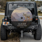 Glacier National Park spare tire cover on a Jeep Wrangler, showing a mountain goat on a ledge above glacier-carved peaks