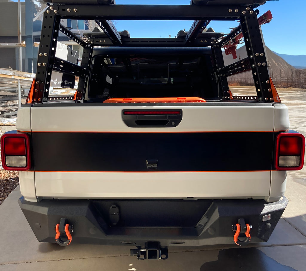 Black blackout tailgate decal with orange pinstripe border on white Gladiator JT