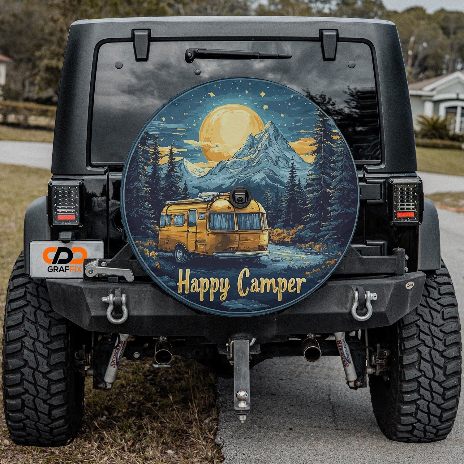 Happy Camper spare tire cover installed on black Jeep Wrangler with center backup camera cutout port