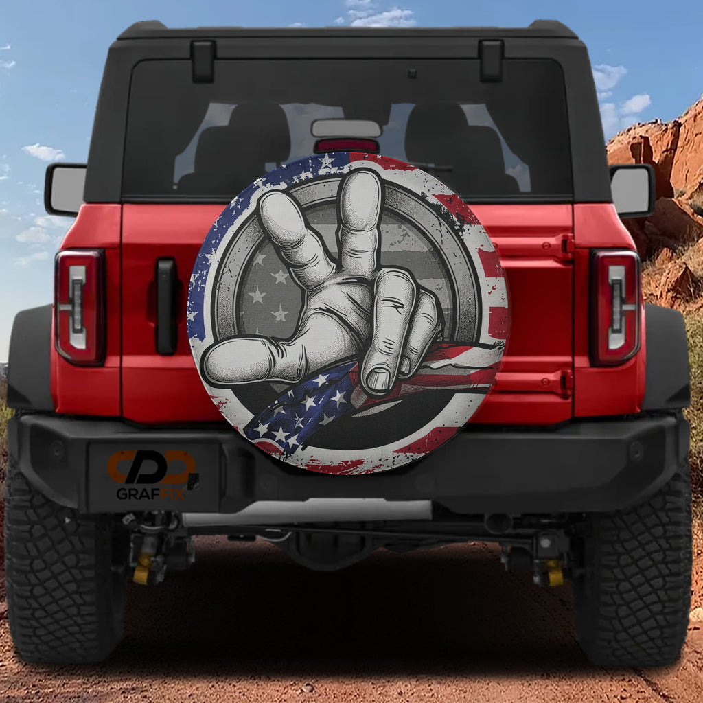 Two Finger Wave American Flag spare tire cover on a red Ford Bronco tailgate