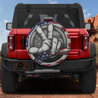 Two Finger Wave American Flag spare tire cover on a red Ford Bronco tailgate