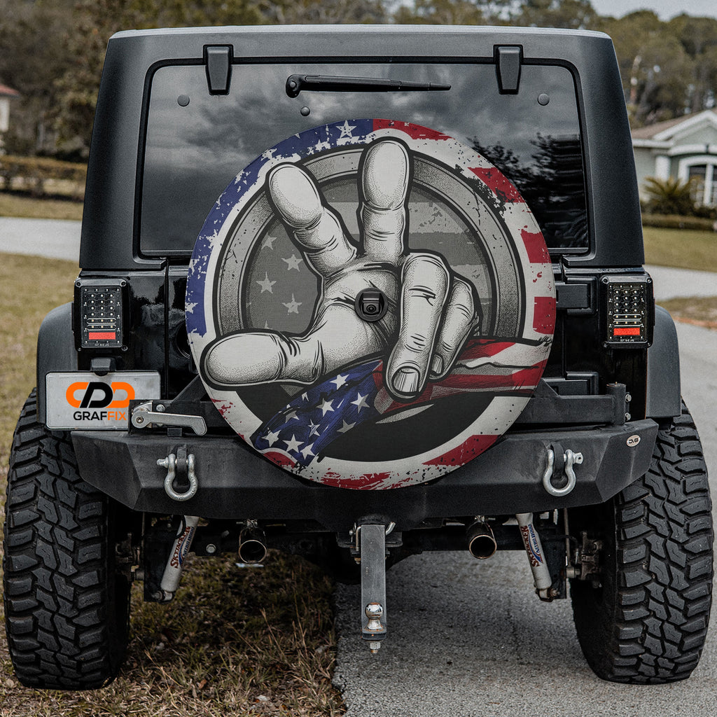 Two Finger Wave American Flag spare tire cover on a black Jeep Wrangler tailgate
