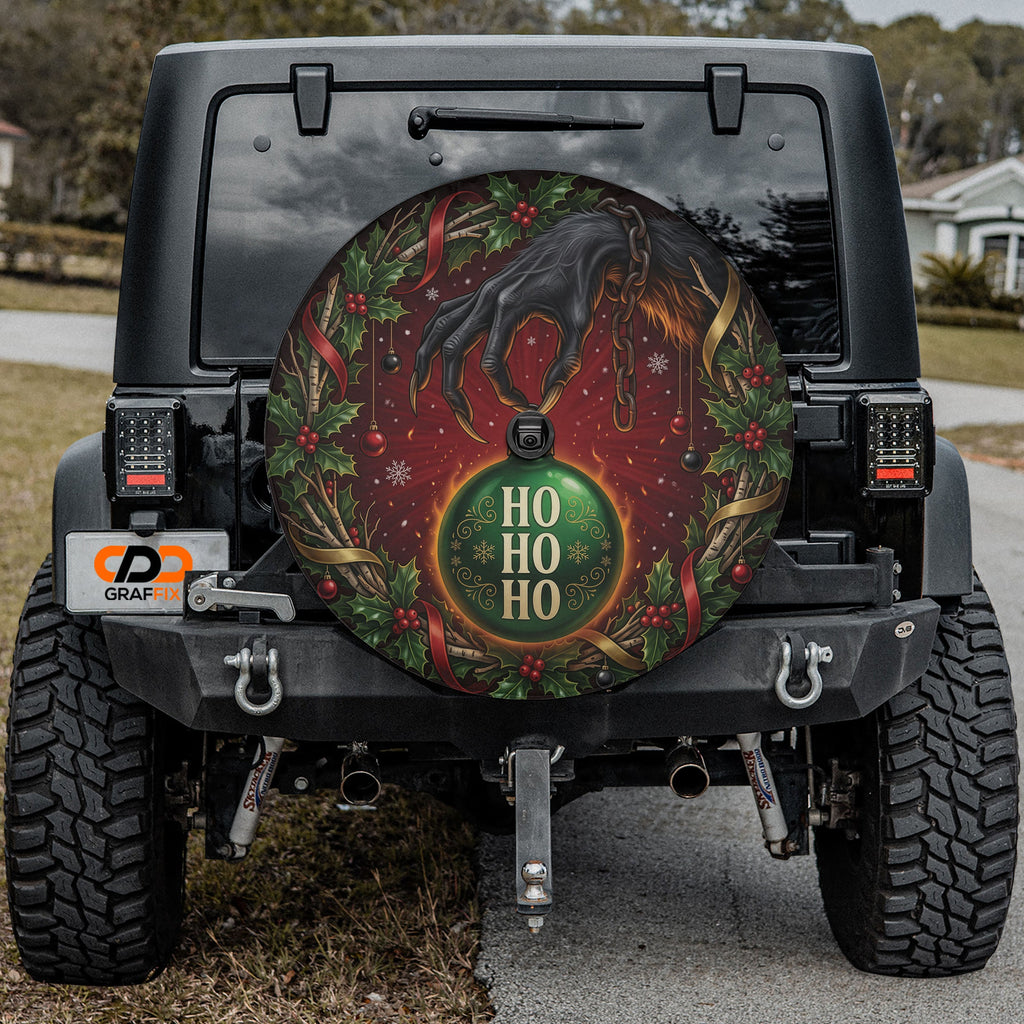 Krampus ornament heist Christmas spare tire cover mounted on a Jeep Wrangler