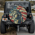 Statue of Liberty patriotic spare tire cover displayed on a Jeep Wrangler with stars and stripes