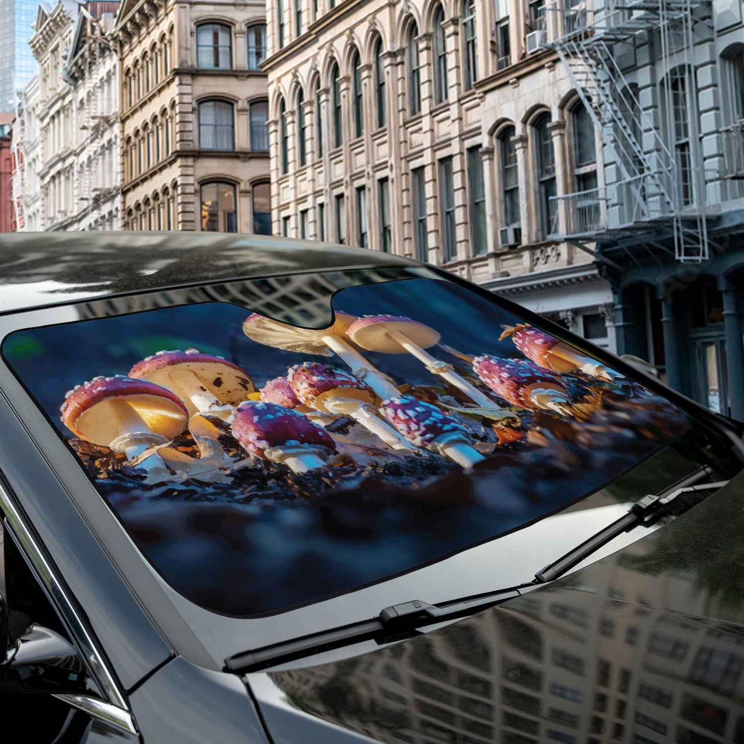 Mushroom Patch accordion sunshade installed in a sedan windshield on a sunny urban city street scene