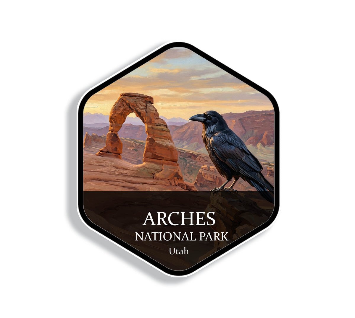 Hexagonal Arches National Park sticker badge with a common raven perched on a sandstone fin above red rock arches at sunrise
