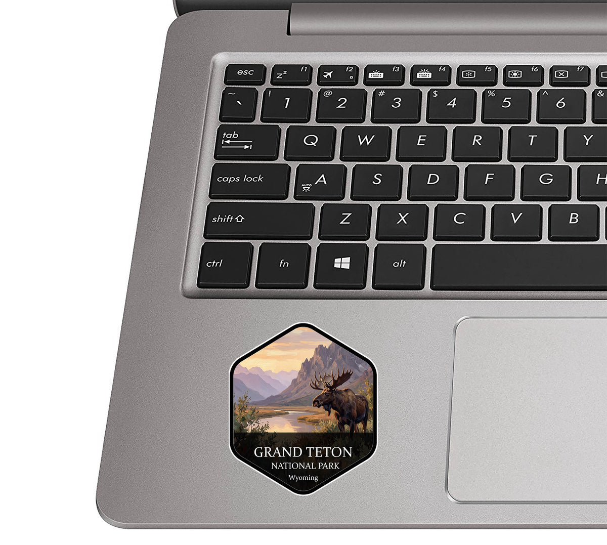 Grand Teton National Park badge sticker applied to the palm rest of a silver laptop