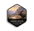 Hexagonal Grand Teton National Park sticker badge with a bull moose on a willow flat below the jagged Teton range at sunrise