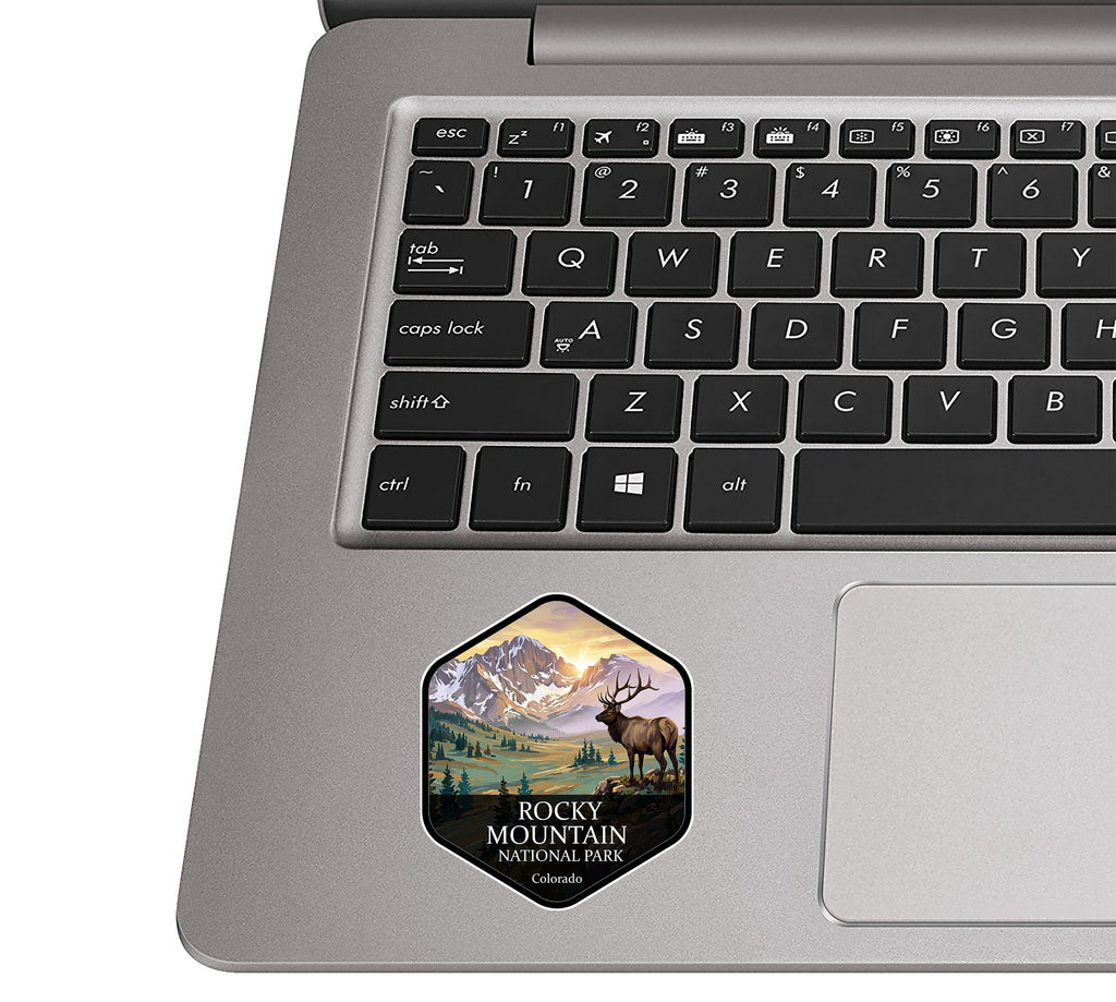 Rocky Mountain National Park badge sticker applied to the palm rest of a silver laptop